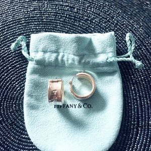 Tiffany & Co small hoop, cuff style sterling silver earrings.